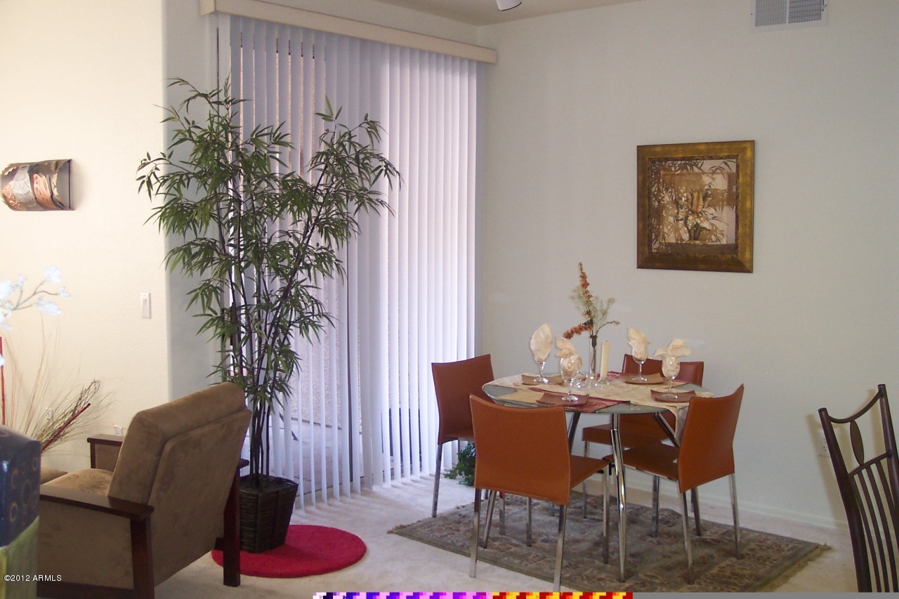 5303 North 7th Street, Unit 113 Phoenix, AZ 85014 - Photo 5 of 21 a view of a livingroom with furniture and a potted plant