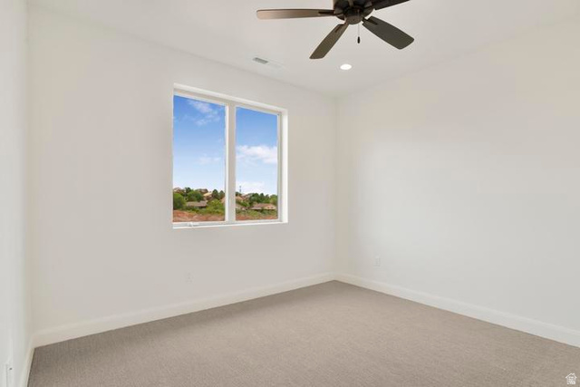 990 Manen Street Washington, UT 84780 - Photo 25 of 43 Room featuring a window with a distant landscape, neutral carpeting, a ceiling fan, and recessed lighting