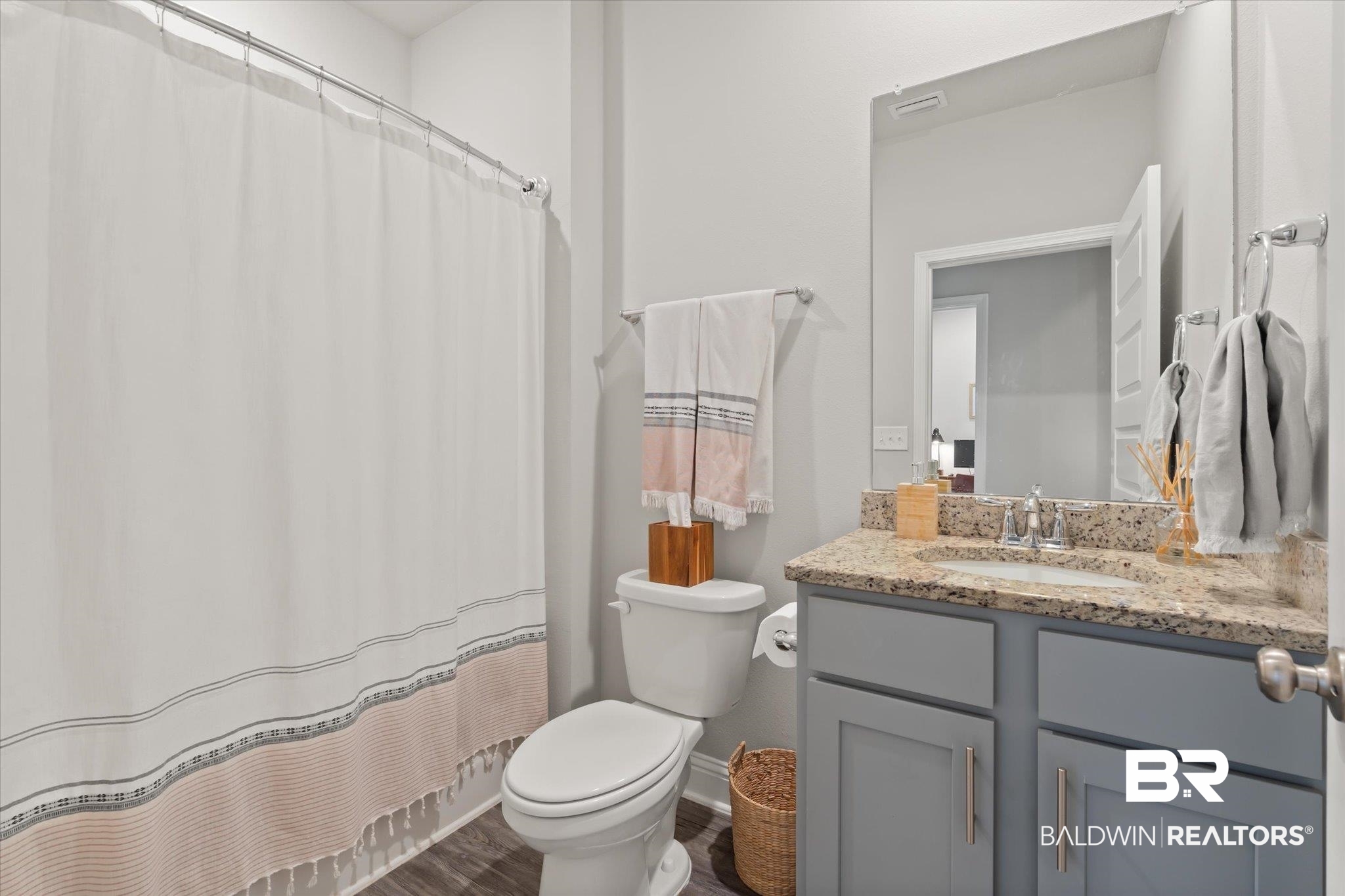 12899 Sanderling Loop Daphne, AL 36527 - Photo 26 of 28 Bathroom with toilet, a shower with curtain, vanity, and wood-type flooring