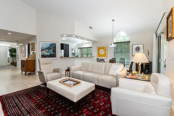 a dining room with furniture and window