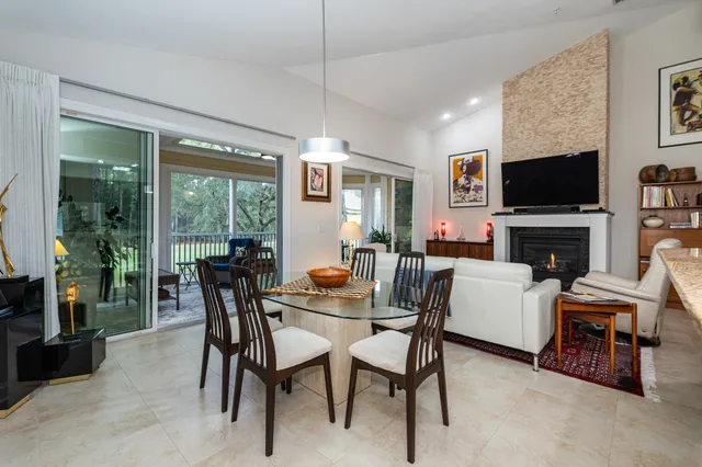a kitchen with stainless steel appliances granite countertop a refrigerator stove and sink