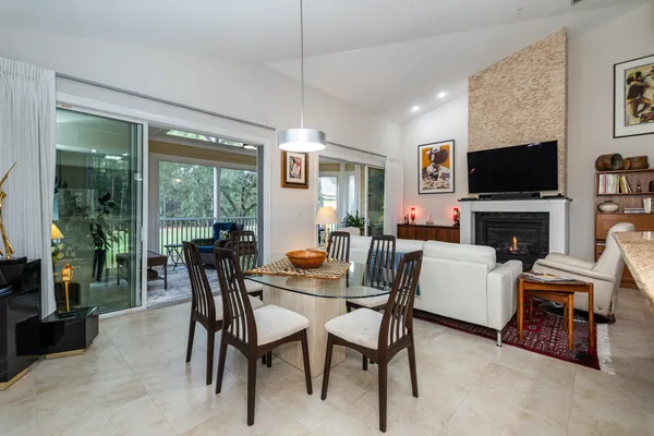 a view of a hallway with paintings on the wall