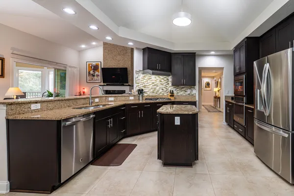 a bedroom with furniture and a large window