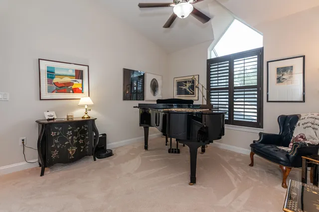 a room with gym equipment and a flat screen tv