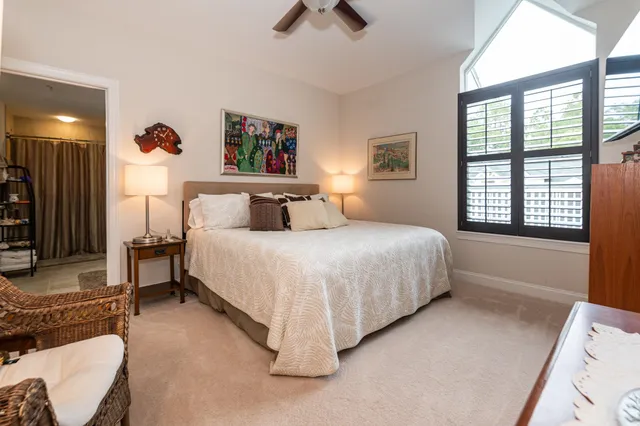 a view of a livingroom with furniture window and wooden floor