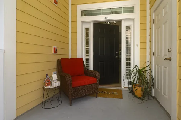 a hallway with furniture and a rug