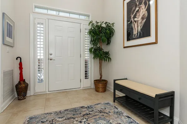 a view of a living room with furniture and a flat screen tv