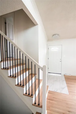 a view of a hallway with staircase