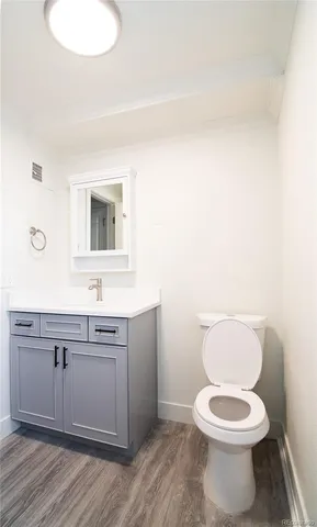 a white toilet sitting next to a bathroom sink