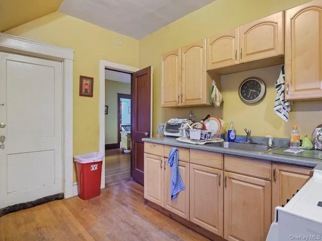 a kitchen with stainless steel appliances granite countertop a sink and cabinets