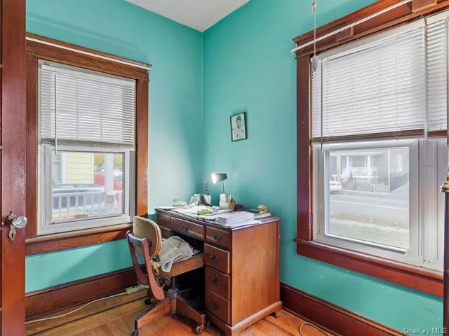 a dining room with furniture and window