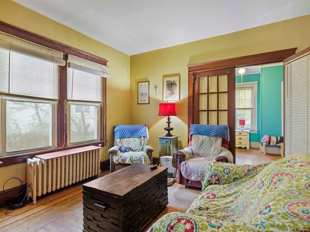 a living room filled with furniture and windows