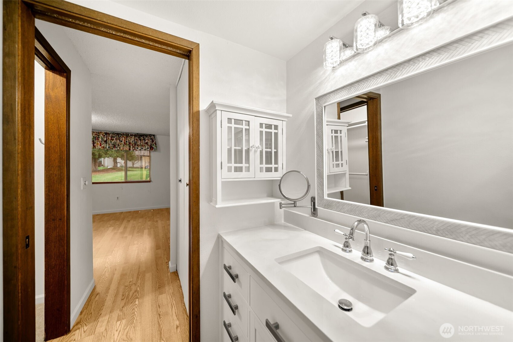 300 South Elliott Avenue, Unit 29 Wenatchee, WA 98801 - Photo 24 of 36 a bathroom with a sink a mirror and a window