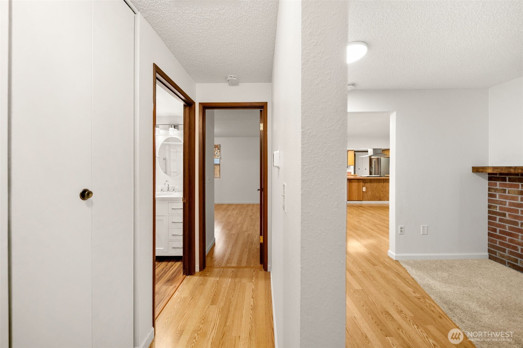300 South Elliott Avenue, Unit 29 Wenatchee, WA 98801 - Photo 25 of 36 a view of a hallway with wooden floor and a bathroom