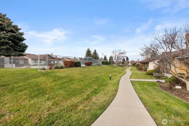 a view of swimming pool with a yard