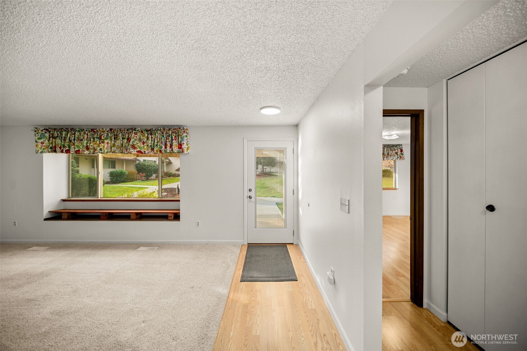 300 South Elliott Avenue, Unit 29 Wenatchee, WA 98801 - Photo 4 of 36 a view of hallway with wooden floor and window