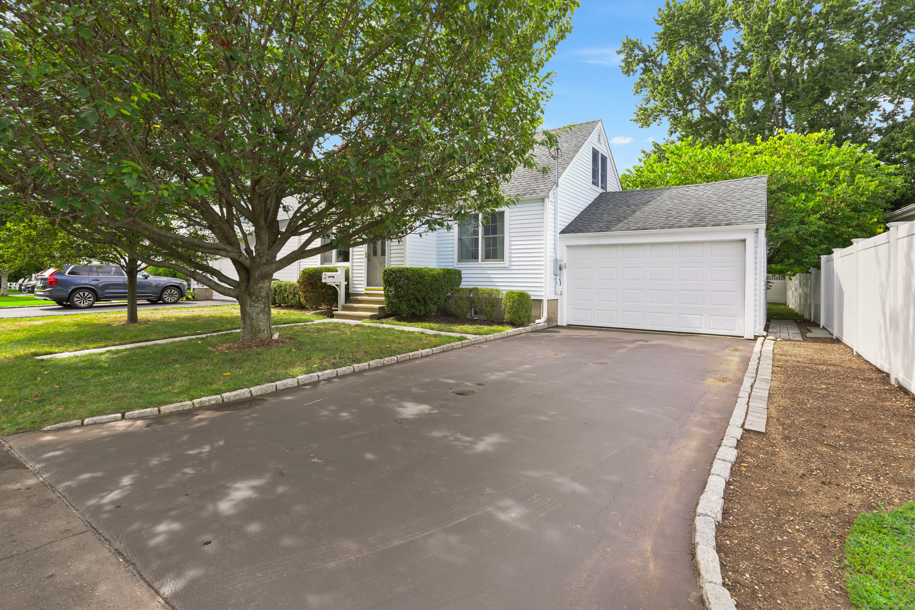 294 Catherine Terrace Fairfield, CT 06824 - Photo 1 of 1 a view of a house with a yard and garage