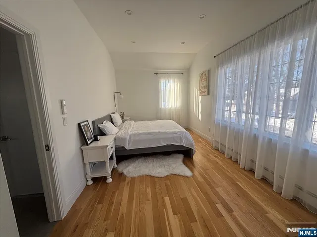 a bed room with a bed and a window