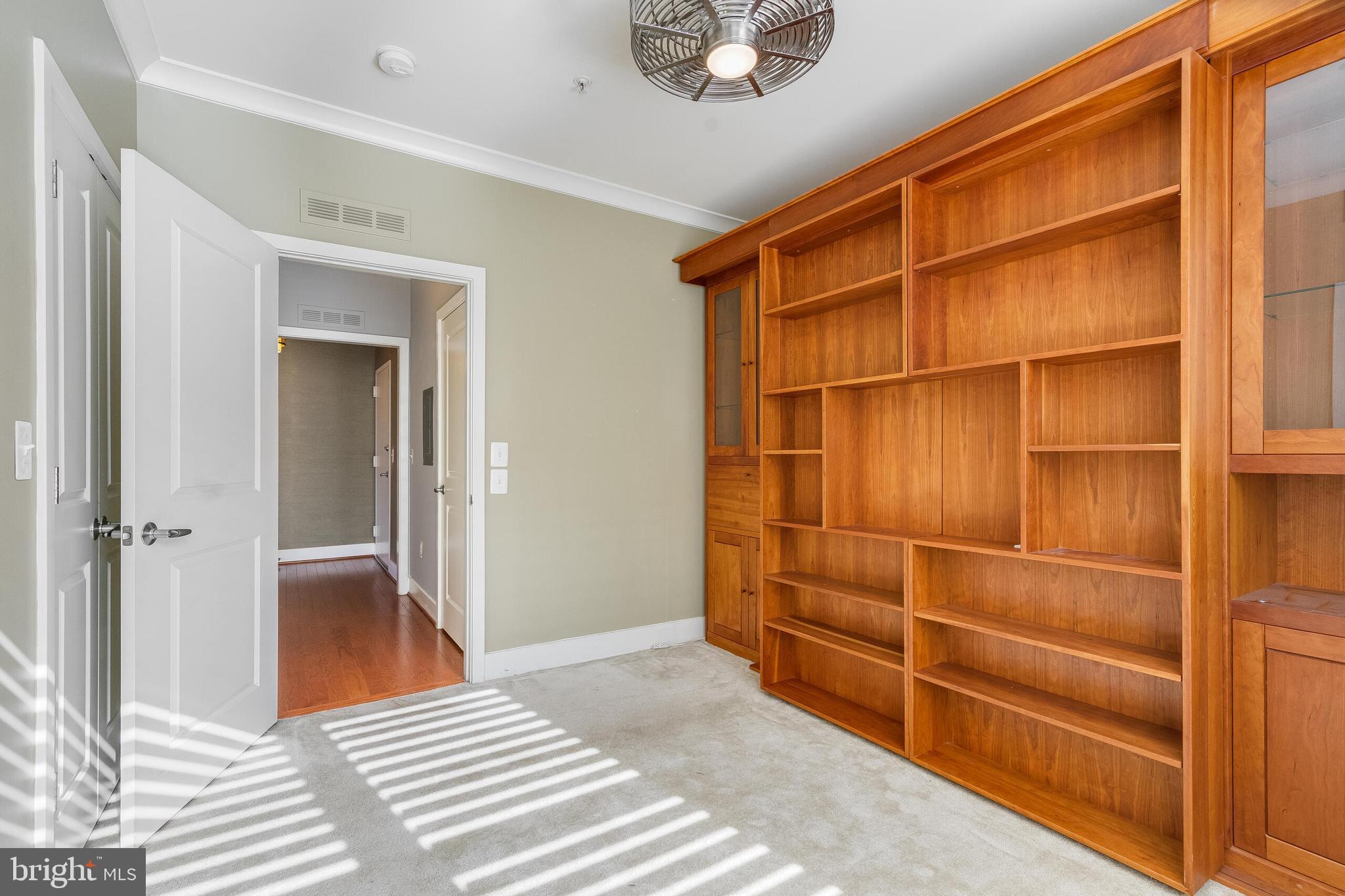 815 North Patrick Street, Unit 402 Alexandria, VA 22314 - Photo 20 of 23 a view of a room with shelves