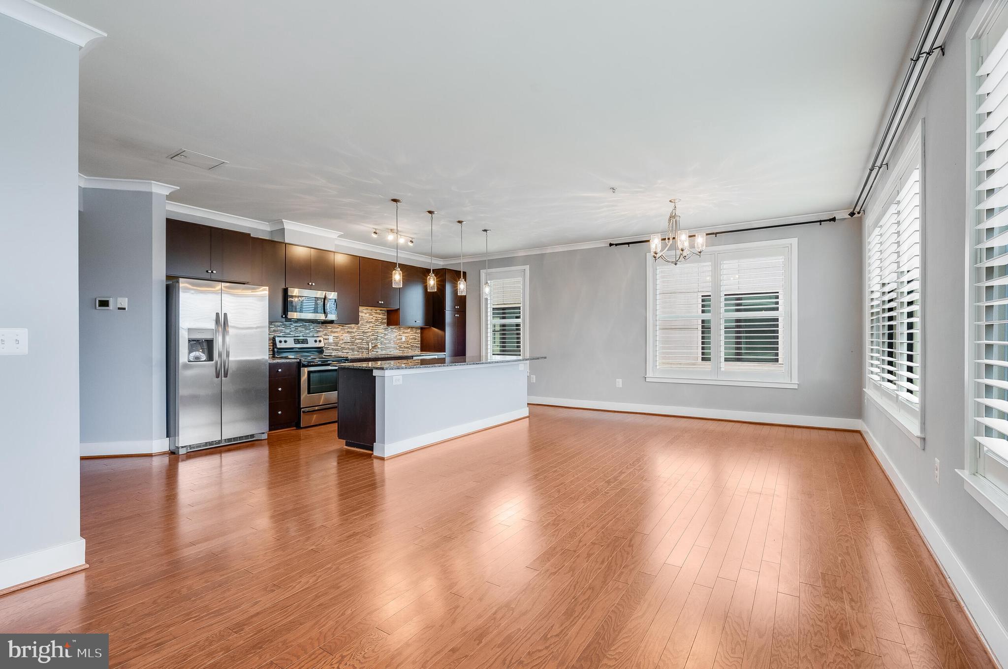 815 North Patrick Street, Unit 402 Alexandria, VA 22314 - Photo 8 of 23 a view of kitchen with cabinets and wooden floor