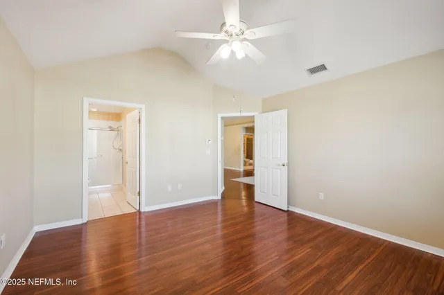a kitchen with stainless steel appliances a refrigerator sink and cabinets