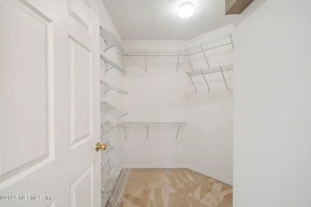 a view of cabinets with wooden floor