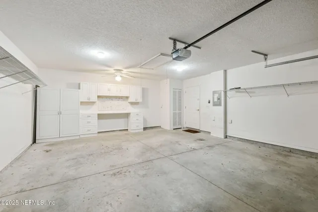 a view of a kitchen with a sink cabinets and wooden floor