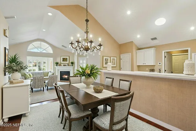 a view of an empty room with a window and fireplace