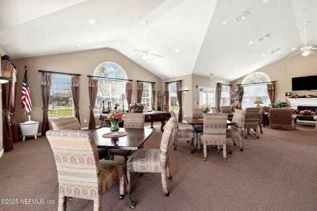 a view of a lake with couches in the patio