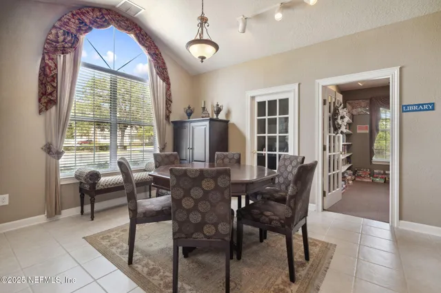 an aerial view of a house with a lake view