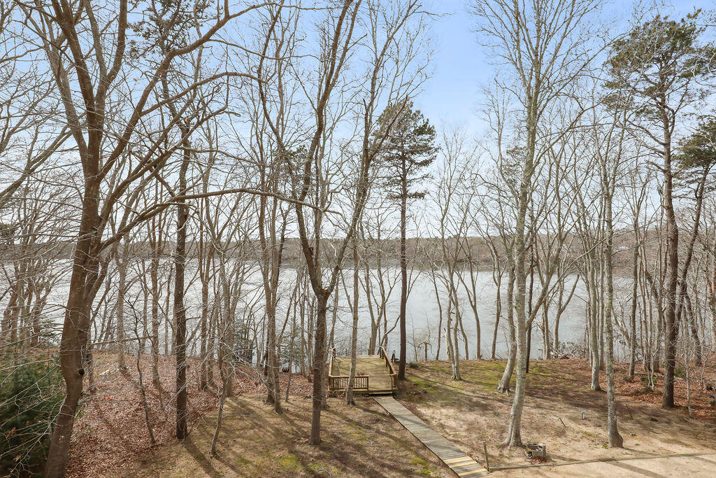 75 Edgewater Road Mashpee, MA 02649 - Photo 8 of 78 a backyard of a house with lots of green space