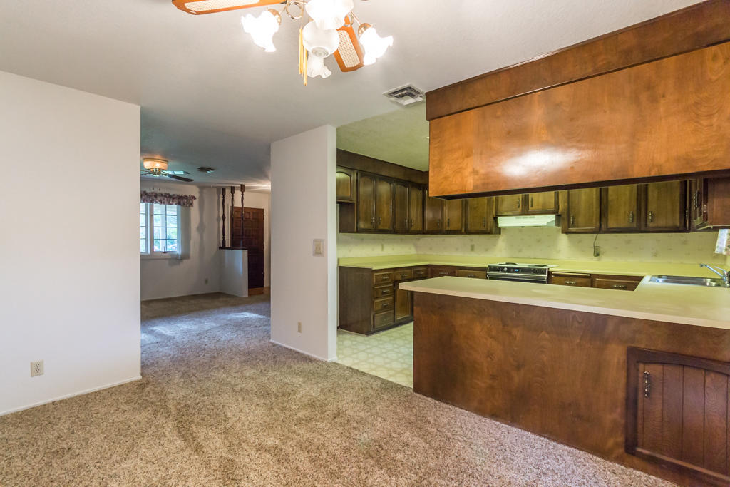 12651 Williamson Road Redding, CA 96003 - Photo 12 of 39 a kitchen with stainless steel appliances granite countertop a sink and a stove