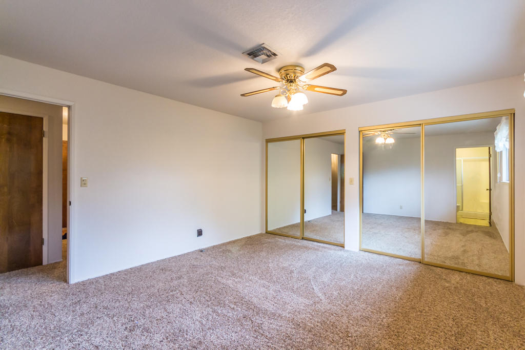 12651 Williamson Road Redding, CA 96003 - Photo 18 of 39 an empty room with closet and a ceiling fan