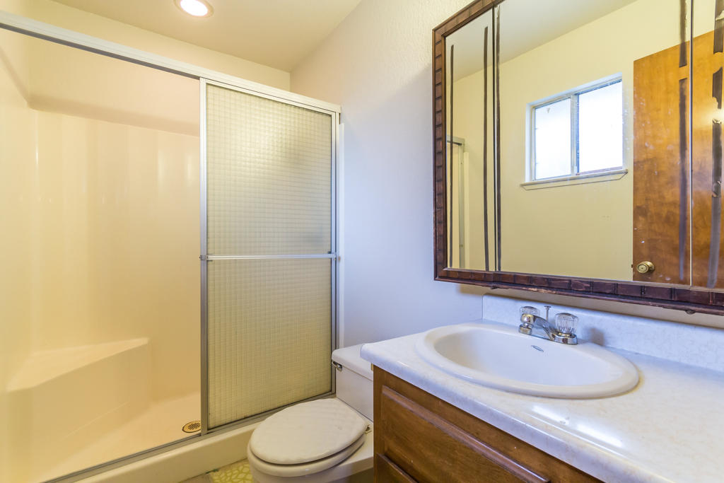 12651 Williamson Road Redding, CA 96003 - Photo 19 of 39 a bathroom with a sink a toilet and shower