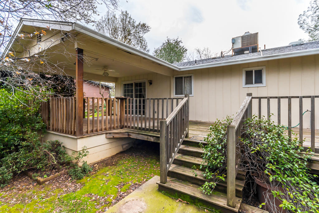 12651 Williamson Road Redding, CA 96003 - Photo 26 of 39 a view of a house with backyard and deck