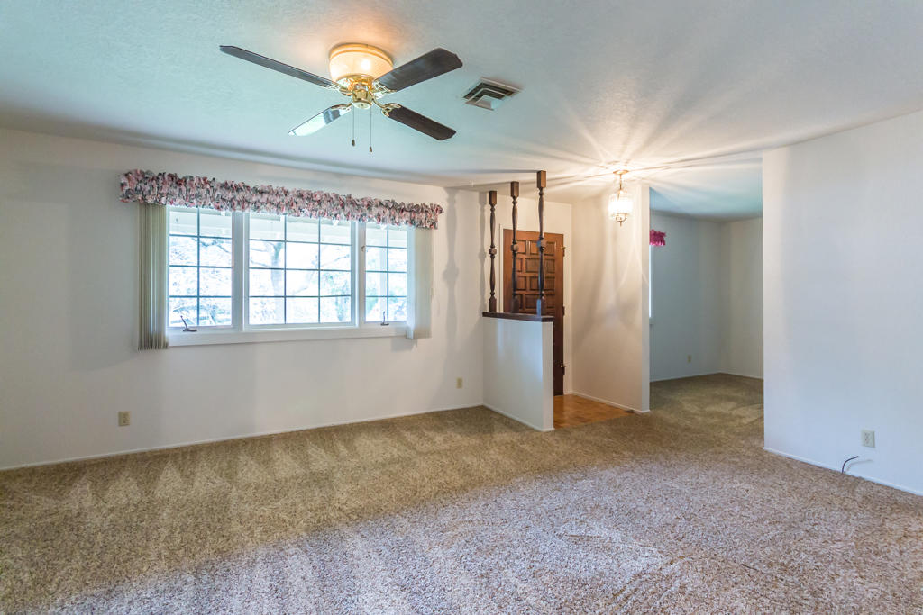 12651 Williamson Road Redding, CA 96003 - Photo 9 of 39 a view of an empty room with a window