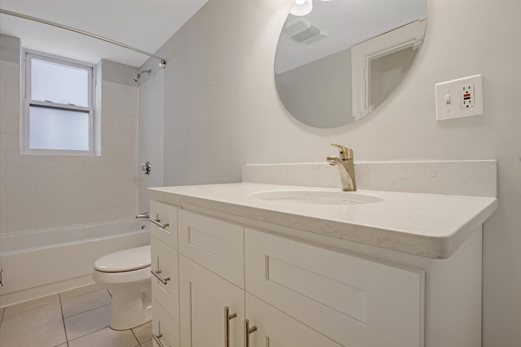 112 Winthrop Road, Unit 5 Brookline, MA 02445 - Photo 16 of 21 a bathroom with a sink a toilet and shower