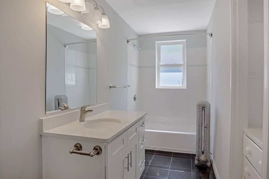 112 Winthrop Road, Unit 5 Brookline, MA 02445 - Photo 17 of 21 a bathroom with a sink and a bathtub