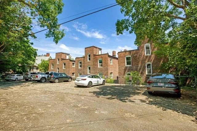 a view of a street with cars