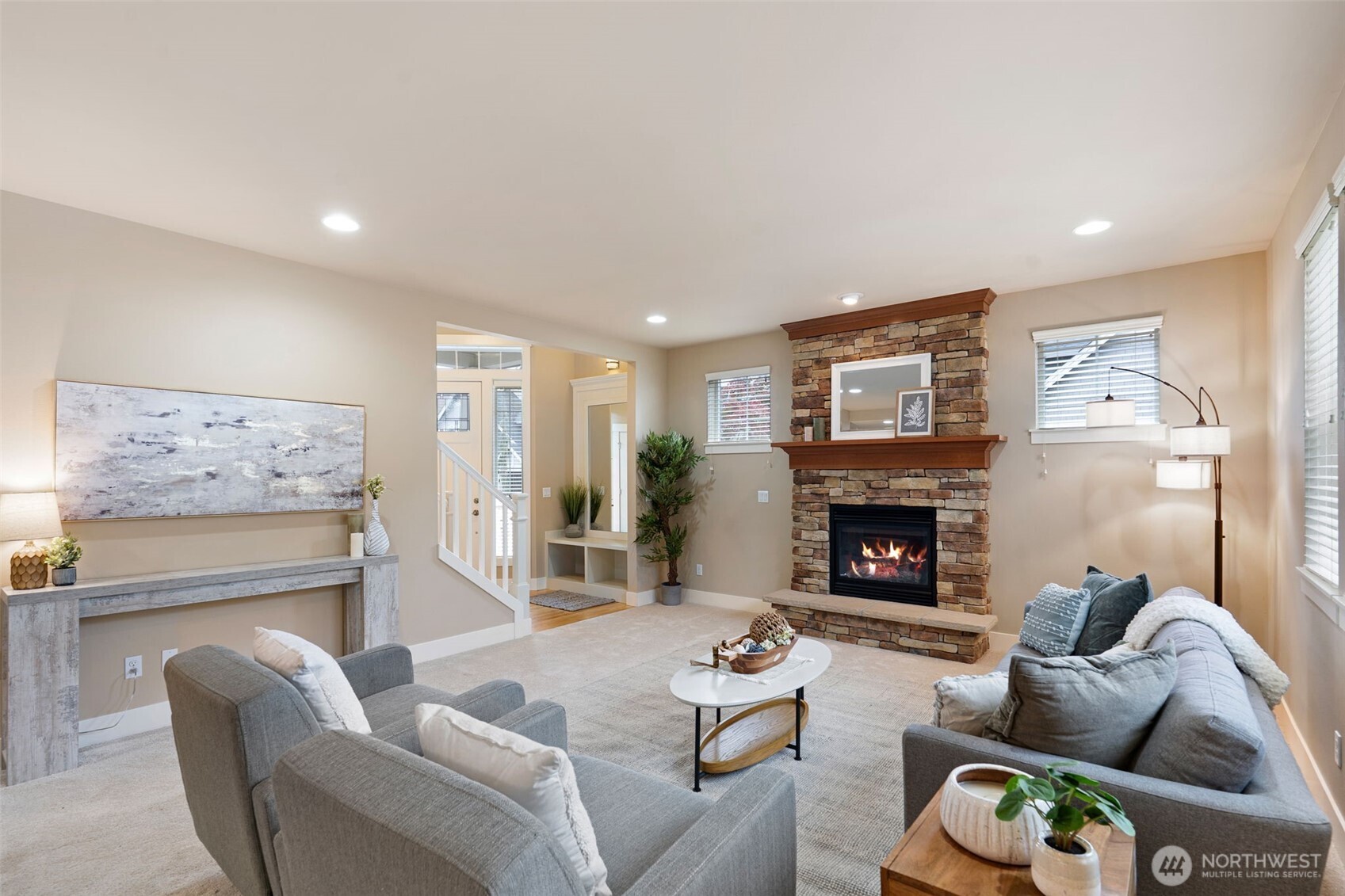 a living room with furniture and a fireplace