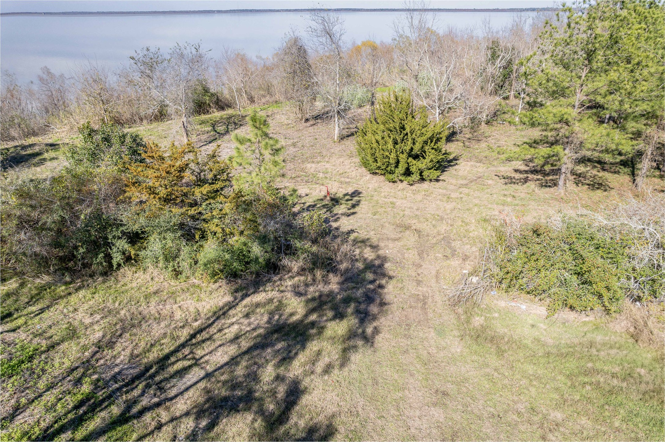 0 Fahring Street Anahuac, TX 77514 - Photo 5 of 11 a view of a pathway with a yard