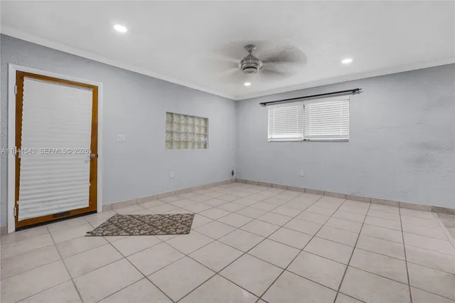 a view of an empty room and window