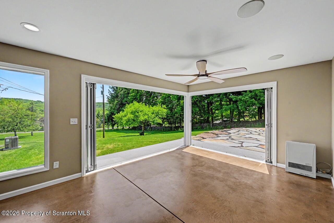 457 Craig Road Dalton, PA 18414 - Photo 53 of 114 a view of a room with wooden floor outdoor space and windows