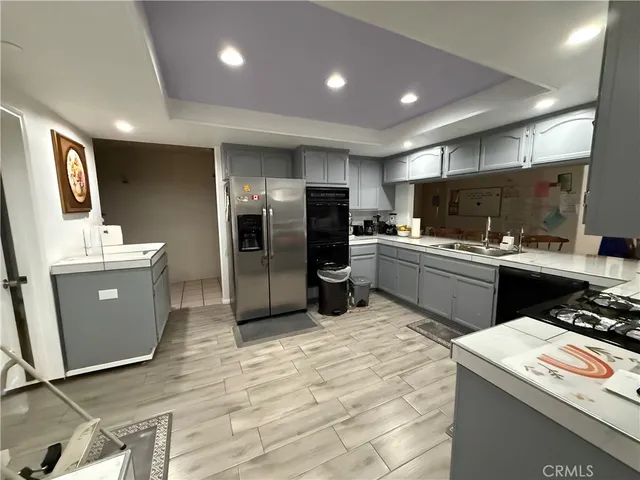a view of a dining room with furniture and a chandelier
