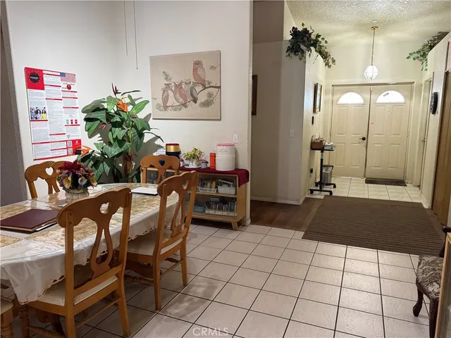 a living room with furniture a table and chairs