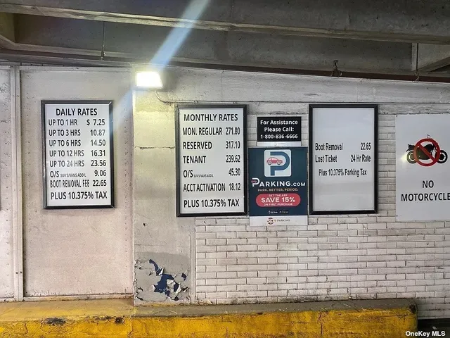 a sign that is on a brick wall