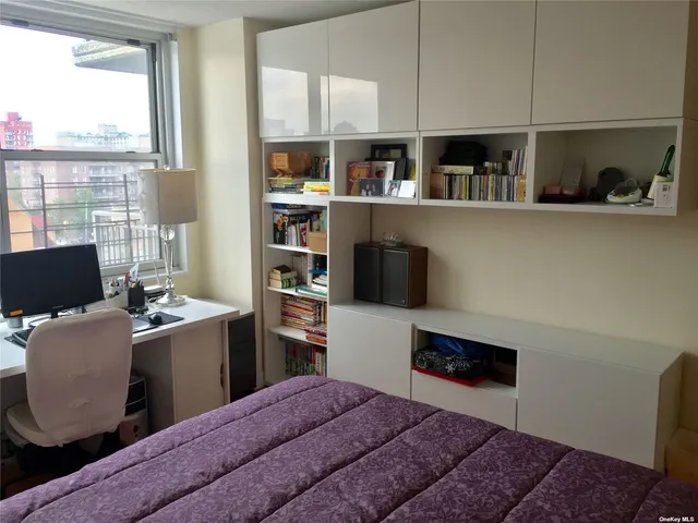 a kitchen with stainless steel appliances granite countertop a refrigerator a stove and a sink with large cabinets