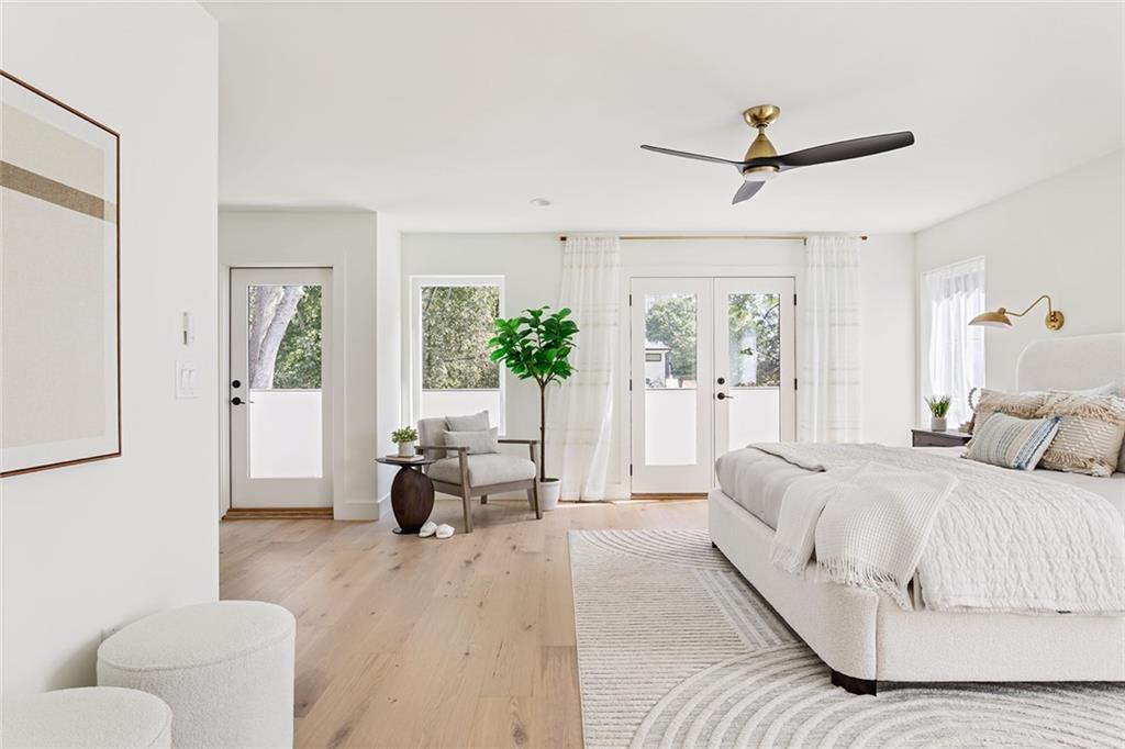 1205 Holly Street Northwest, Unit B Atlanta, GA 30318 - Photo 19 of 81 a spacious bedroom with a bed and a couch