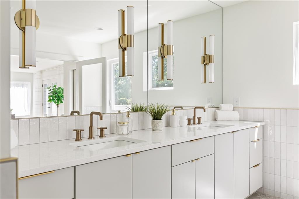 1205 Holly Street Northwest, Unit B Atlanta, GA 30318 - Photo 21 of 81 a bathroom with double sink and a mirror