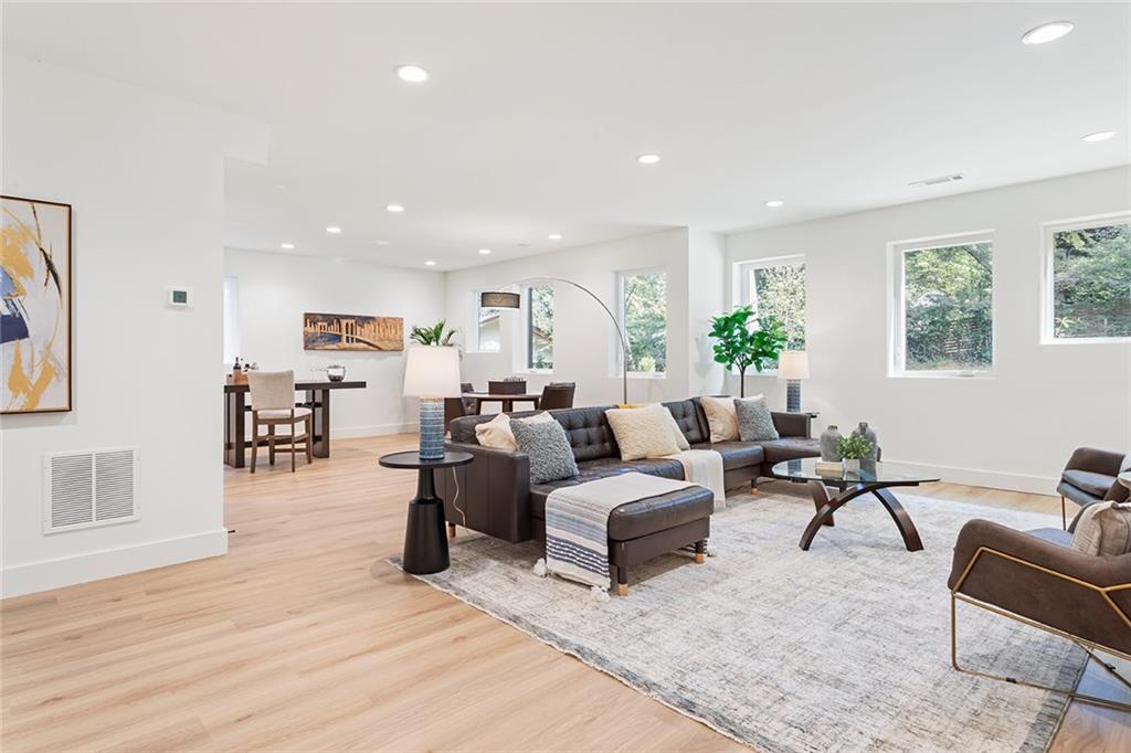 1205 Holly Street Northwest, Unit B Atlanta, GA 30318 - Photo 30 of 81 a living room with furniture and a wooden floor